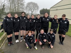 Northallerton Girls Football team in their new black training tops.